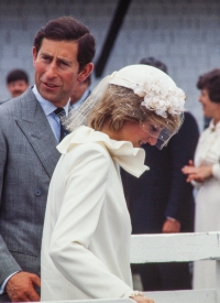 Charles glances back as he and Diana prepare to board the royal barge in St. Andrews, NB