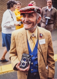 84-year-old John Knickle showed up to cover the royals with his Yashica camera and homemade press pass. Lunenburg, NS