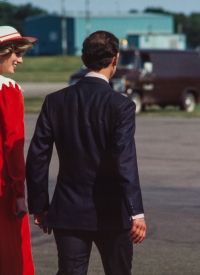 "We did it, Charles!" Diana smiles as they cross the tarmac for their plane home. Charlottetown, PEI